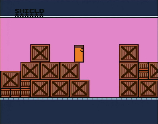 An orange rectange standing on large wooden crates